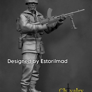 May include: A grayscale miniature figure of a soldier in uniform, holding a machine gun. The figure wears a helmet and is equipped with a backpack and other gear. The text "Designed by Estorilmad" is visible. The logo for "Chivalry Miniatures 3D" is also present.