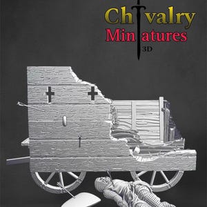 May include: A 3D printed miniature of a fallen knight in chainmail armor lying next to a broken wooden wagon. The wagon has a broken wheel and is missing a section of its side. The knight's shield is lying on the ground next to him. The miniature is painted in a silver color. The text "Chivalry Miniatures 3D" is visible in the top right corner of the image.
