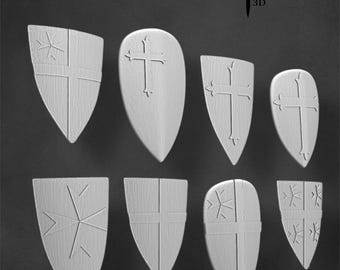 May include: Eight white shield designs with different patterns, including crosses and stars. The shields are all made of a textured material and are arranged in two rows of four. The shields are labeled "Chivalry Miniatures 3D".