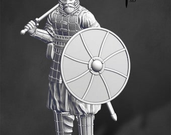 May include: A 3D printed miniature of a Viking warrior wearing a helmet and chainmail armor, holding a sword and shield. The miniature is painted in a gray color and is ready to be assembled and painted.
