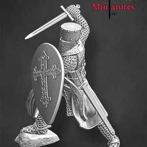 May include: A detailed miniature of a medieval knight in full armor, holding a sword and shield. The knight is wearing chainmail and a helmet with a visor. The shield has a cross design. The miniature is made of metal and is painted in a silver color. The miniature is on a base.
