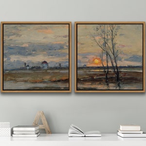 May include: A pair of framed landscape paintings depicting a sunset over a field. The left painting shows a small village in the distance, while the right painting shows a group of trees silhouetted against the setting sun.