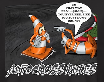 May include: A black t-shirt with a cartoon illustration of two traffic cones on a race track. The text "GO THAT WAY BRO!.....(SIGH)....YOU EVER FEEL LIKE YOU JUST DON'T COUNT?" is in a speech bubble above the cones. The text "AUTOCROSS RULES" is below the cones.