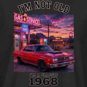 May include: A black short-sleeve t-shirt featuring a graphic of a red vintage car parked at a neon-lit gas station during sunset. The text reads I'M NOT OLD at the top and I'M A CLASSIC 1968 at the bottom. A small logo is on the right sleeve.