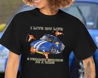May include: Black t-shirt with a blue and white cartoon car and the text "I live my life 2 tenths seconds at a time".