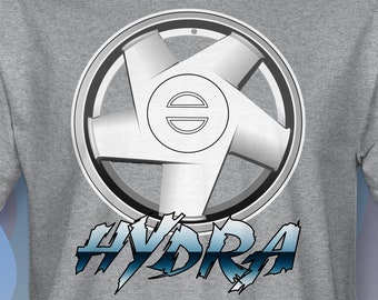 May include: A gray t-shirt with a white stylized wheel design and the word "HYDRA" in blue and white lettering.
