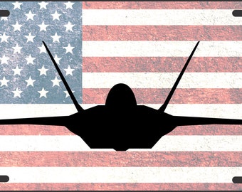 May include: A black silhouette of a fighter jet against a distressed American flag background. The flag is red, white, and blue with a grunge texture.