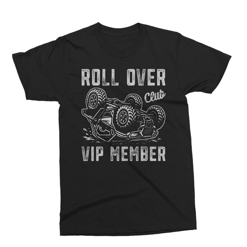 May include: Black t-shirt with a distressed white graphic. The graphic features a stylized off-road vehicle flipped over, with the words "ROLL OVER Club" and "VIP MEMBER" in a bold font.