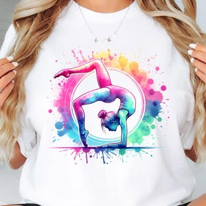 May include: A white t-shirt with a colorful watercolor design of a gymnast performing a handstand on a balance beam.