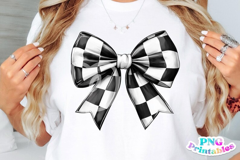 May include: A white t-shirt with a black and white checkered bow drawn on the front. The bow is large and has a center knot.