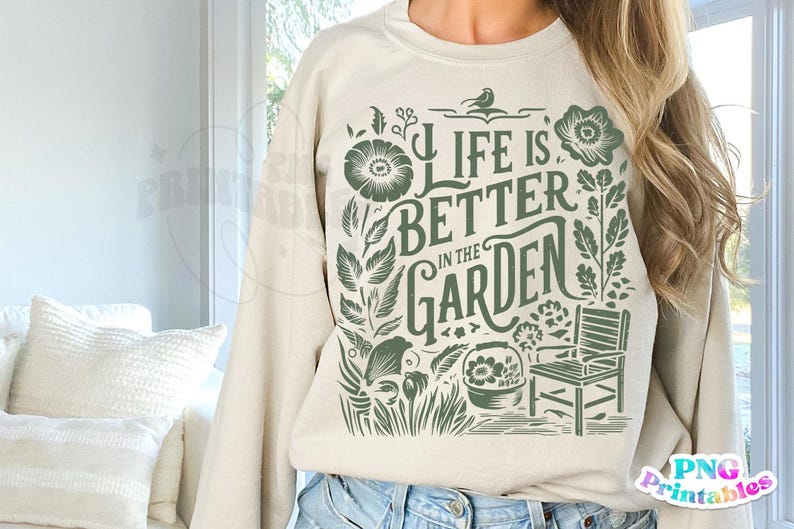 May include: A beige sweatshirt with a green floral design and the text "Life is better in the garden".