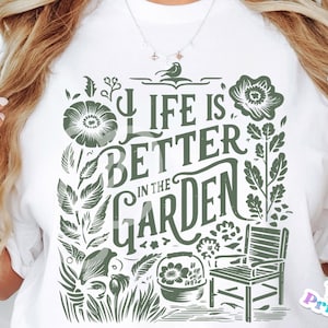 May include: A white t-shirt with a green floral design and the text "Life is Better in the Garden".