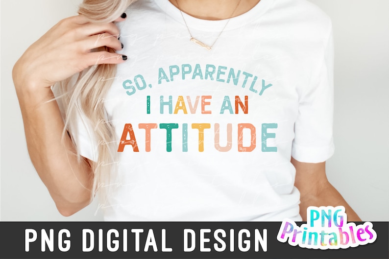 May include: A white t-shirt with the text "So, Apparently I Have An Attitude" in colorful, distressed lettering.
