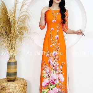 Áo dài nữ may sẵn thiết kế đẹp nền cam hoa đào cách tân tết - Ao Dai with design on background of peach blossom orange - Pre-made AO DAI