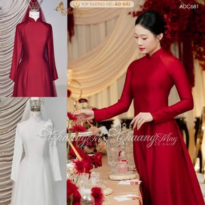 May include: A red, long-sleeved dress with a high collar, displayed on a mannequin and worn by a person. The dress has a flowing silhouette. A white dress with a similar design is also shown. The image includes text.