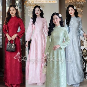 May include: Four women in long, flowing dresses in red, pink, green, and blue-grey. The dresses feature a mandarin collar and long sleeves. The dresses have floral patterns and are floor-length.