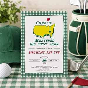 Könnte beinhalten: Eine rechteckige Geburtstagseinladungskarte mit einem grün-weißen Vichy-Karo-Rand. Der Text lautet: Charlie Mastered His First Year, Please Join Us For A Birthday Par-Tee, Saturday September 26 2026 at 12 PM, sowie weitere Veranstaltungsdetails.