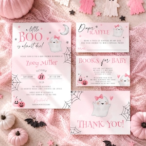 May include: A pink baby shower invitation set featuring a ghost with a pink bow, spider webs, and stars. The text reads A little BOO is almost due, Diaper Raffle, Books for Baby, and Thank You, with event details for Zoey Miller on October 27.
