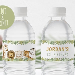 May include: Two clear plastic water bottles with labels featuring a jungle theme. The labels have a green leafy border and feature a giraffe, lion, elephant, tiger, and zebra. One label says "Jordan's 1st Birthday".
