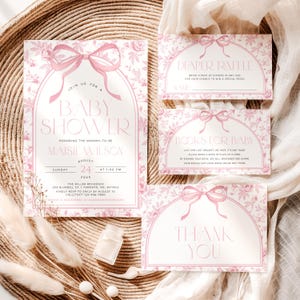 May include: A set of baby shower invitations and inserts with a floral and bow design in shades of pink. The main invitation includes the text "Baby Shower" and event details. Additional cards include "Diaper Raffle," "Books for Baby," and "Thank You."