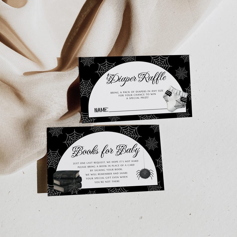 May include: Two black and white baby shower invitation cards. One card says "Diaper Raffle" and the other says "Books for Baby". Both cards have a spiderweb design and illustrations of a diaper and a spider.