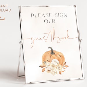 May include: A printable sign with a watercolor illustration of a pumpkin and flowers. The sign says "Please sign our guestbook".