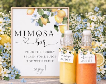 May include: A Mimosa Bar sign with a wooden frame, featuring lemons and blue flowers. Two glass bottles with mango and orange juice are in front of the sign. The sign reads "Mimosa Bar" and instructions.