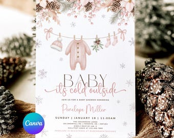 Peut inclure: Une invitation à une baby shower sur le thème hivernal. L'invitation présente un body rose, un bonnet et des chaussettes suspendus à une corde à linge, avec le texte "BABY its cold outside". L'invitation est pour Pénélope Miller.
