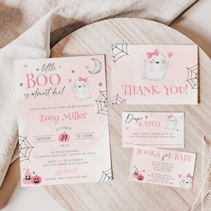 May include: A set of baby shower stationery in light pink featuring ghost illustrations with pink bows, spider webs, and stars. The text includes A little BOO is almost due, Zoey Miller, October 29, 2022, Diaper Raffle, and Books for Baby.