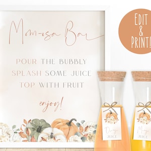 May include: Printable sign for a "Mimosas Bar" with instructions to "Pour the bubbly, splash some juice, top with fruit, enjoy!"  The sign is decorated with fall-themed watercolor illustrations of pumpkins, leaves, and flowers. Two glass beverage dispensers with cork tops are also shown, each with a tag that says "Orange Juice" and "Mango Juice".