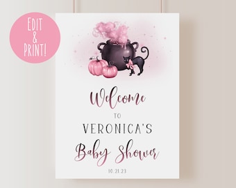 May include: A pink and black baby shower welcome sign with a cauldron, pumpkins, and a black cat. The text reads "Welcome to Veronica's Baby Shower 10.21.23".