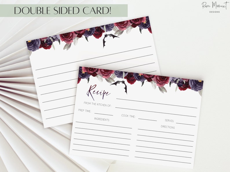 May include: Double-sided recipe card with a floral design featuring dark red and purple flowers, vines, and bats. The card has lines for writing down a recipe, including prep time, cook time, ingredients, serves, and directions.