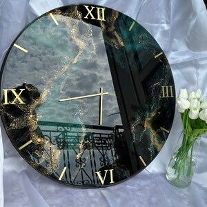 Watch in black, petroleum green and gold resin