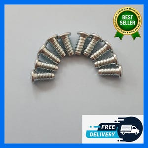 May include: A collection of silver screws arranged in a semi-circle. Each screw has a flat head and a threaded shaft. The image includes a "Best Seller" badge and a "Free Delivery" graphic.
