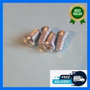 May include: Four silver screws with Phillips head slots are arranged on a light blue surface. The screws are made of metal and have a threaded design. A "Best Seller" badge and a "Free Delivery" graphic are in the background.