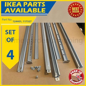 May include: A set of four silver-colored IKEA furniture parts, including various metal rails and fasteners. The image includes text that reads "IKEA PARTS AVAILABLE" and "SET OF 4".