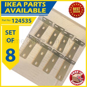 May include: A set of eight metal IKEA furniture brackets. The brackets are silver-coloured and have a T-shape with pre-drilled holes. The image includes text that says "IKEA PARTS AVAILABLE" and "SET OF 8".