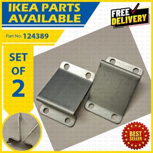 May include: A set of two grey metal brackets with four circular mounting holes each. The image includes text stating IKEA PARTS AVAILABLE, Part No: 124389, SET OF 2, FREE DELIVERY, and BEST SELLER. The brackets have a bent, rectangular shape.