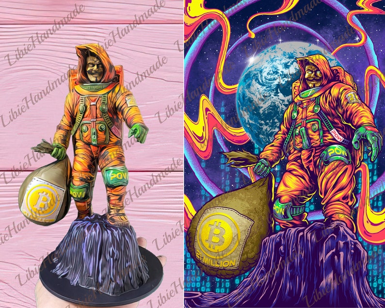 May include: A 3D printed figurine of an astronaut holding a bag of Bitcoin. The astronaut is wearing an orange and green spacesuit with a yellow helmet. The bag is brown and has a Bitcoin logo on it. The figurine is standing on a black base.