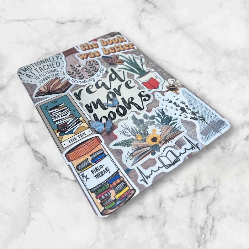 May include: A white background with various colorful stickers featuring book-themed designs. The stickers include text such as "the book was better", "reading is lit", "read more books", "the TBR", and "Bibliotherapy".