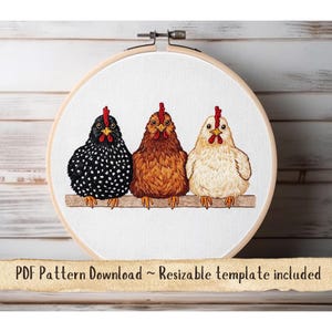 May include: Embroidered hoop art showing three chickens on a wooden perch. The chickens are black and white, brown, and cream, each with a red comb. The text "PDF Pattern Download ~ Resizable template included" is at the bottom of the image.