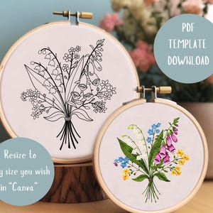 May include: Two embroidery hoop patterns featuring floral bouquets. The first hoop shows a black and white line drawing of a bouquet of lilies of the valley, foxgloves, and other flowers. The second hoop shows a colored embroidery pattern of a similar bouquet with pink, purple, and yellow flowers.