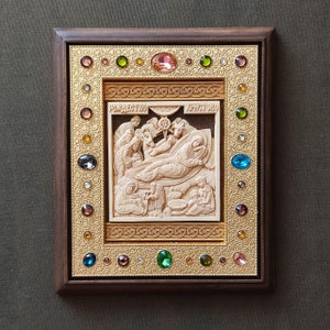 Carved handmade wood icon.The Nativity of Christ.The Birth of Christ.Icon of the Mother of God.religious holiday.Orthodox and Catholic icons