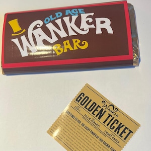 May include: A chocolate bar with the text "OLD AGE WANKER BAR" in white and yellow lettering on a brown background. A golden ticket with the text "GOLDEN TICKET" and "WANKER" is also visible.