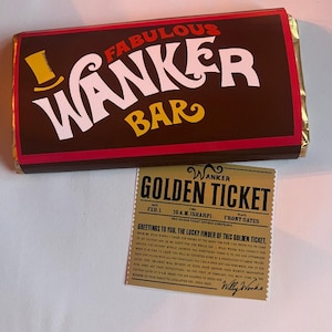 May include: A brown chocolate bar wrapper with the text "FABULOUS WANKER BAR" in white and yellow. A golden ticket with the text "GOLDEN TICKET" and "Willy Wonka" is next to the bar.