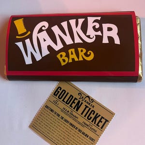 May include: A brown chocolate bar with the text "WANKER BAR" in white and yellow, and a golden ticket. The golden ticket reads "GOLDEN TICKET" and includes text about a factory visit.