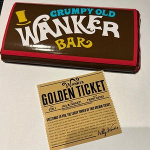 May include: A chocolate bar with the text "GRUMPY OLD WANKER BAR" in white and yellow lettering. A golden ticket with the text "GOLDEN TICKET" and "Willy Wonka" is also visible.