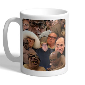 May include: White ceramic mug with a collage of images of a man wearing glasses. The images are of the same man with different expressions. The mug has a white handle.