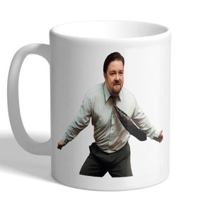 May include: White ceramic mug with a printed image of a man in a light blue shirt and dark trousers, with a loosened tie. The mug has a curved handle and a glossy finish. The image is a humorous depiction.