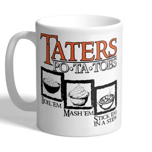 May include: White ceramic mug with the words "Taters Po-Ta-Toes" in orange and black lettering. The mug features illustrations of potatoes prepared in three ways: boiled, mashed, and in a stew.